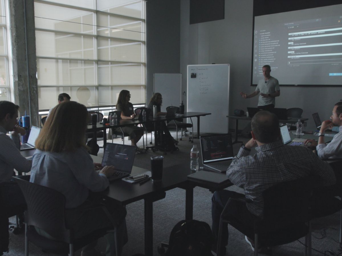 Austin teaching a hands-on AI training session